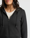 Womens Black Crop Zip Hoodie over ribbed crew-neck shirt.