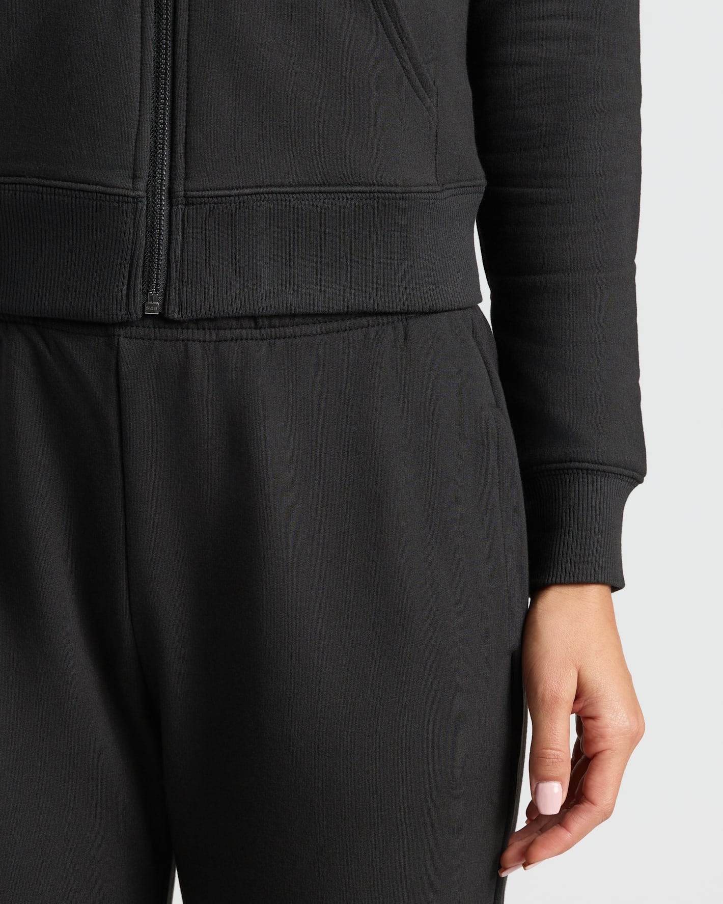 Womens Black Crop Zip Hoodie with kangaroo pocket and relaxed fit.