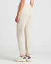 Womens Oatmeal Relaxed Joggers with elastic cuffs and white sneakers.