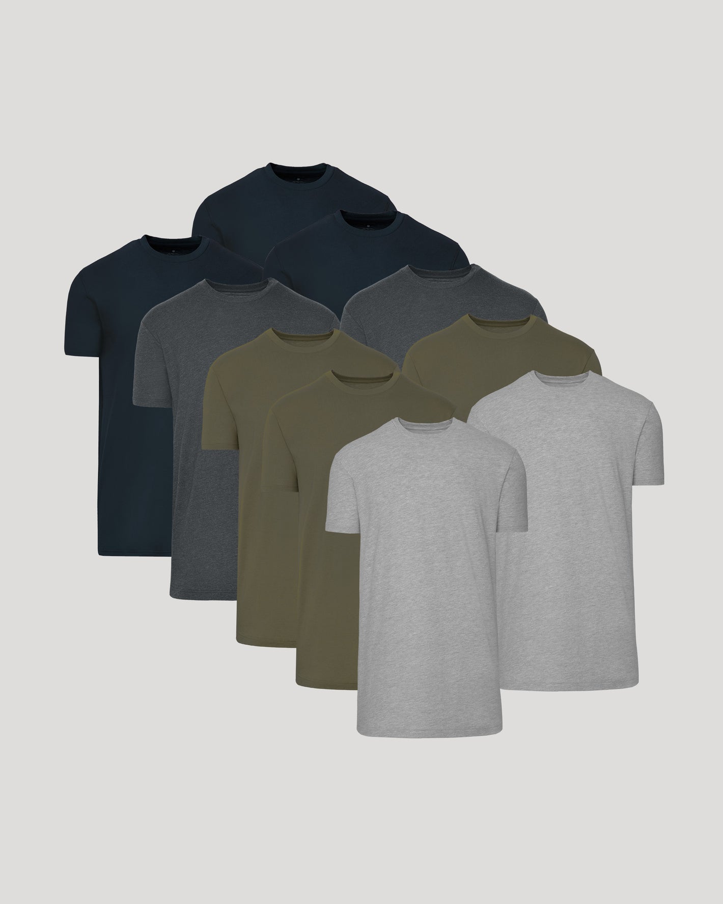 Stack of nine crew neck t-shirts in black, charcoal, olive, and gray with straight hems.