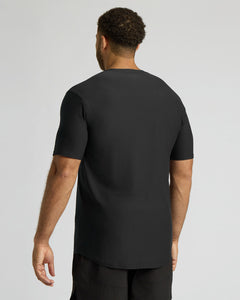 True ClassicMan wearing a black t-shirt on a light gray background