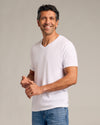Man wearing Carbon Green Classic V-Neck, showcasing its fit and style.