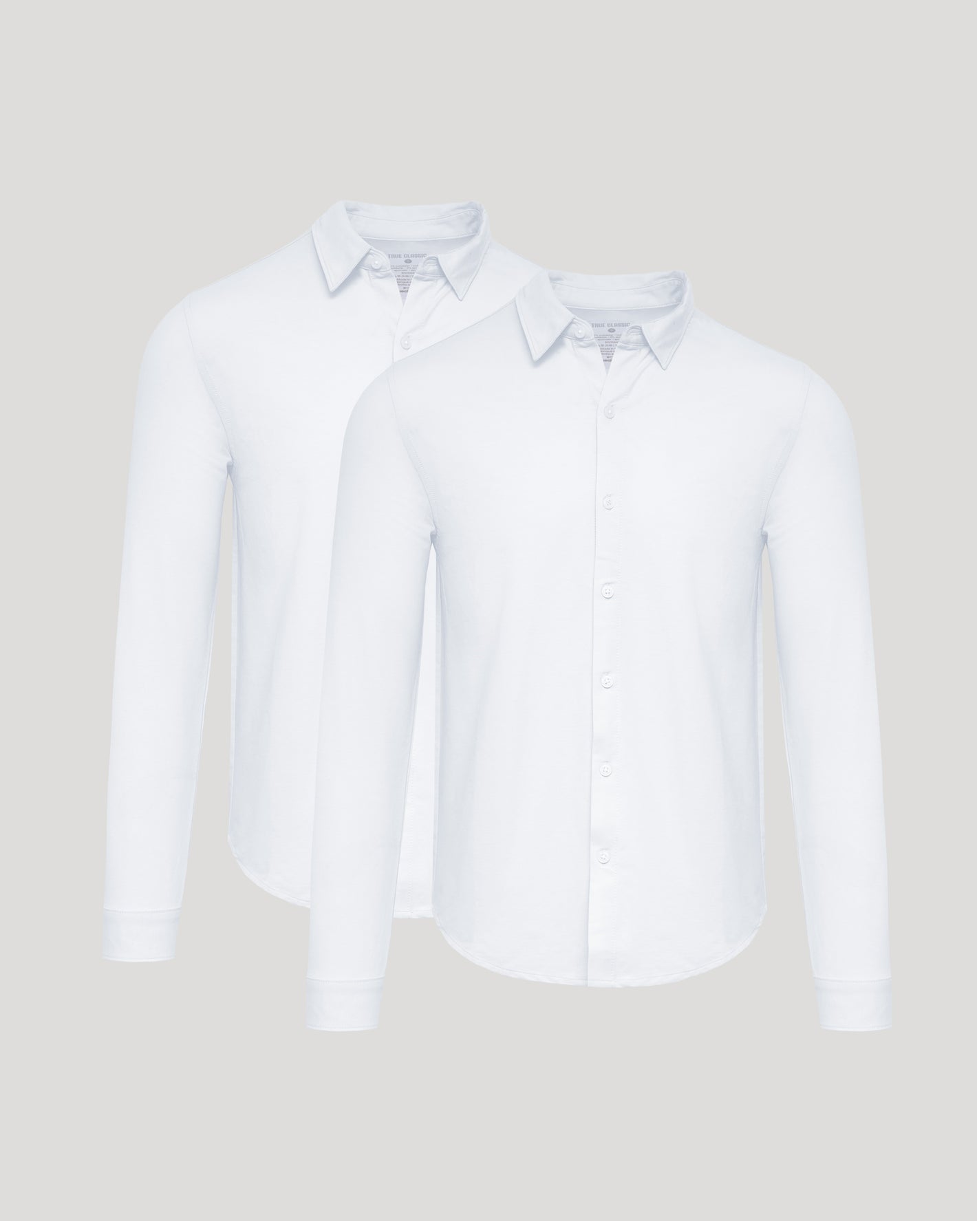 White Stretch Long Sleeve Modern Knit Oxford 2-Pack, overlapping, button-up shirts.