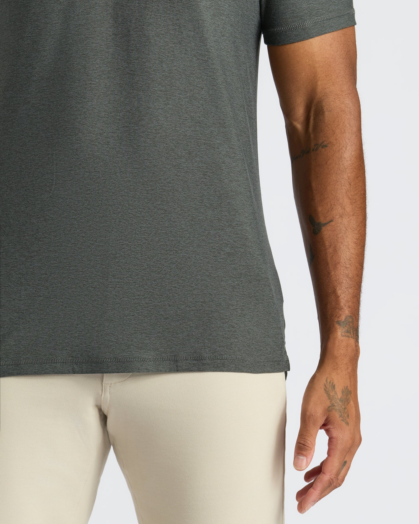 True Classic Men’s Classic Polo, showcasing tattoos on forearm, premium fit.