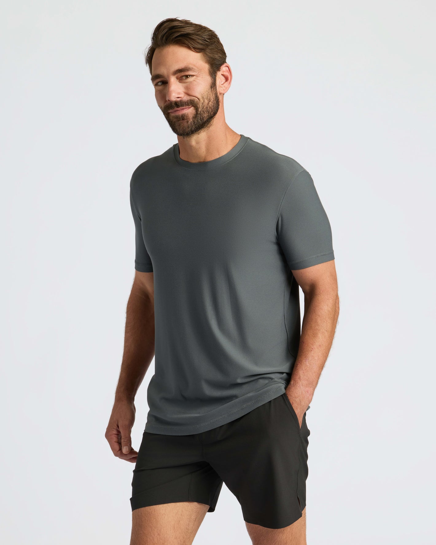 Man wearing Classic Polo with shorts, hand in pocket.