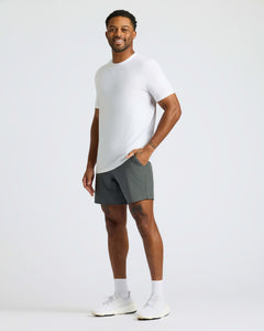 True ClassicMan wearing White Active Crew Neck Tee, gray shorts, and white shoes.