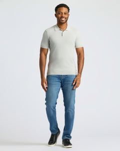 True ClassicMan wearing Classic Polo and slim-fit jeans, standing relaxed.
