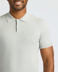 True ClassicMan wearing Classic Polo with two-button placket and visible forearm tattoo.