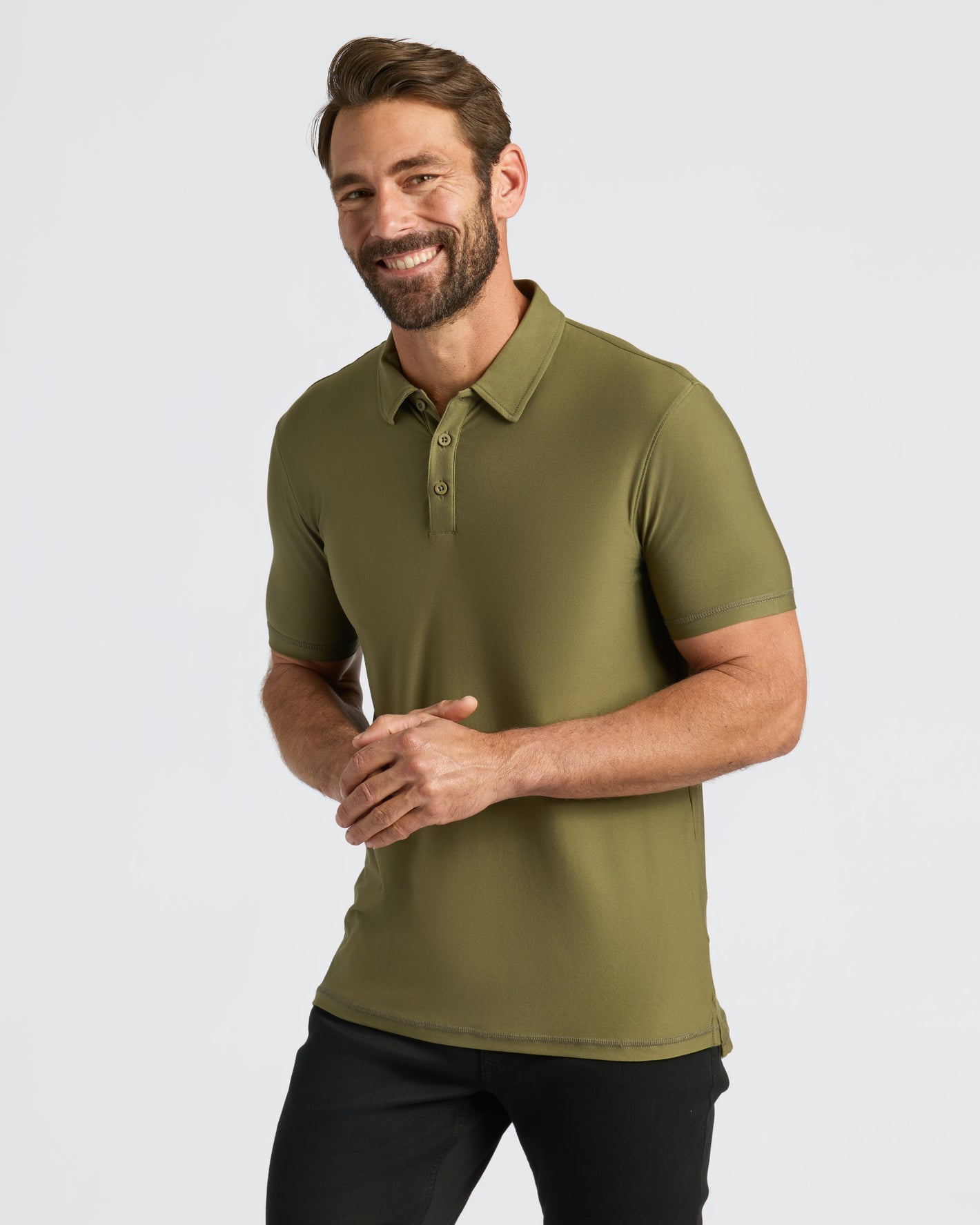 Man wearing Military Green Active Polo 2.0, showcasing its fitted design.