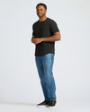 All Black Curved Hem Classic Crew Neck 10-Pack worn by smiling man.