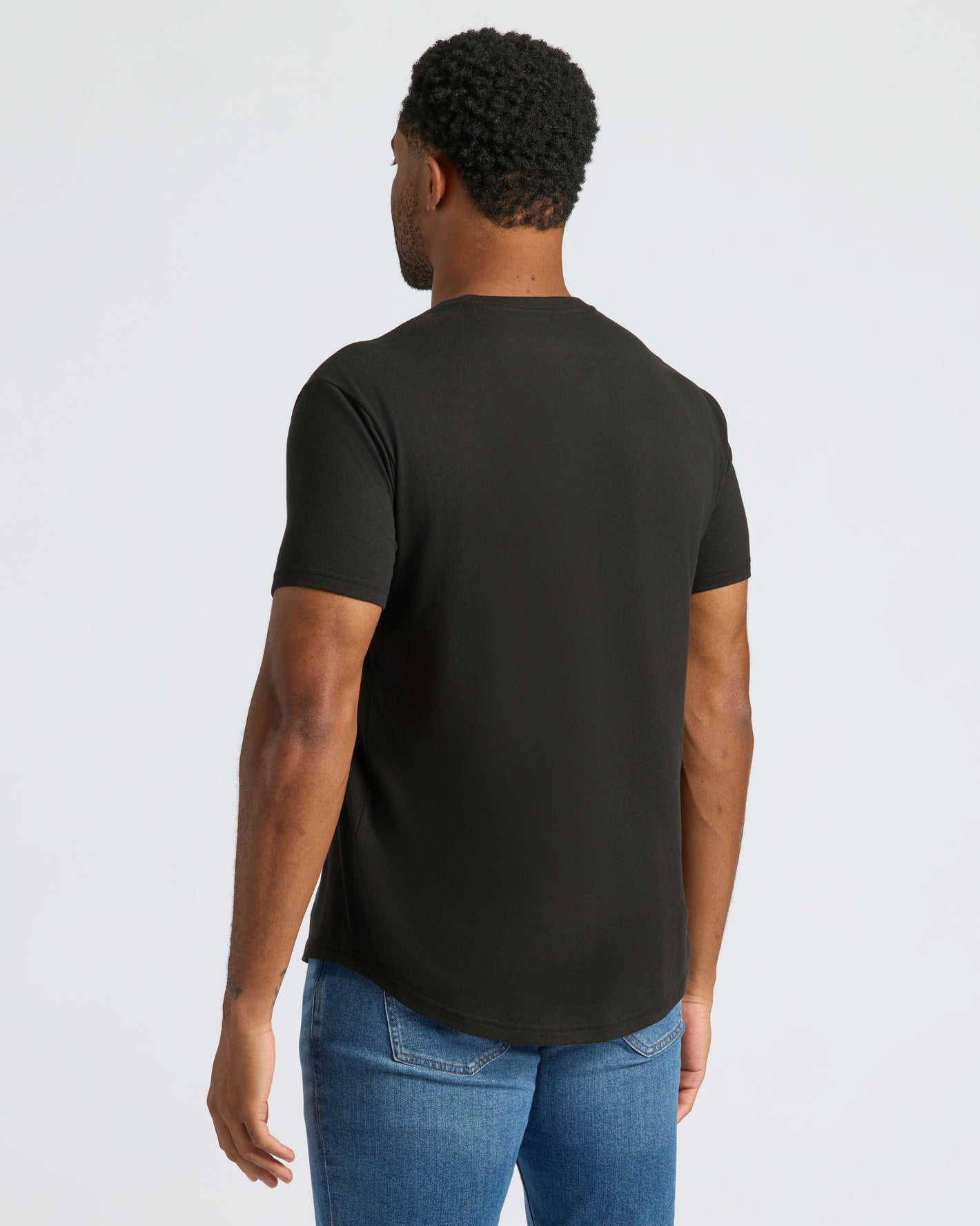 Man in All Black Curved Hem Classic Crew Neck T-shirt.