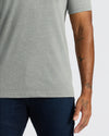 True Classic Men’s V-Neck T Shirt, soft cotton blend, tattoos visible.