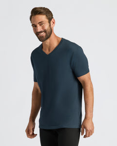 True ClassicMan wearing Classic V-Neck T-shirt, smiling in studio.
