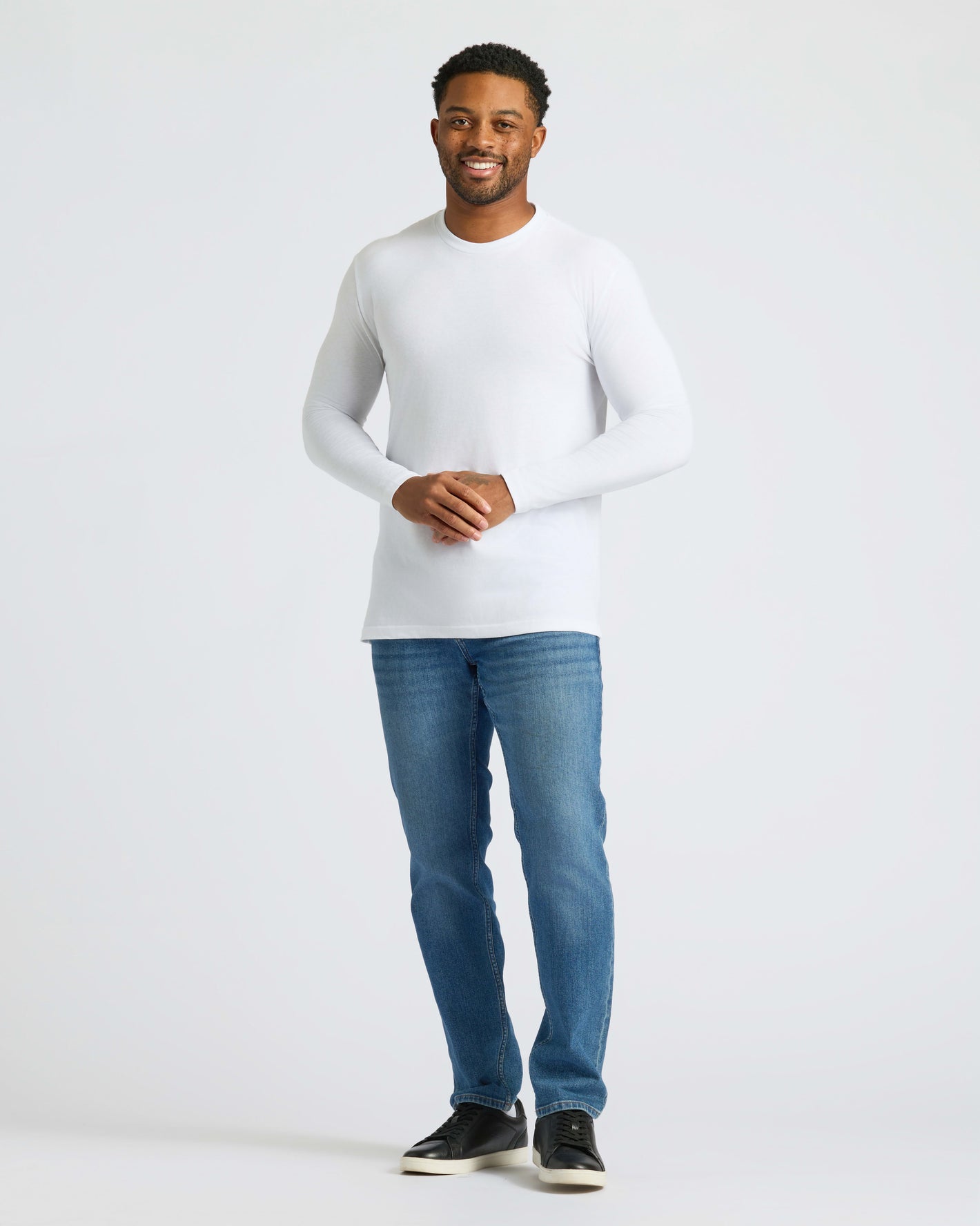 Man wearing All White Long Sleeve Crew Neck 3-Pack.