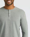 Man in True Classic Men’s Long Sleeve Henley, soft cotton blend, classic 3-button style.