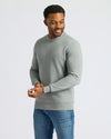 Heather Gray Fleece French Terry Pullover Crew Neck on man adjusting sleeve cuff.