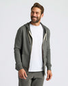Man in Charcoal Heather Gray Fleece French Terry Zip Hoodie.