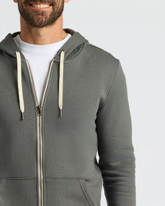 True ClassicCharcoal Heather Gray Fleece French Terry Zip Hoodie worn casually.