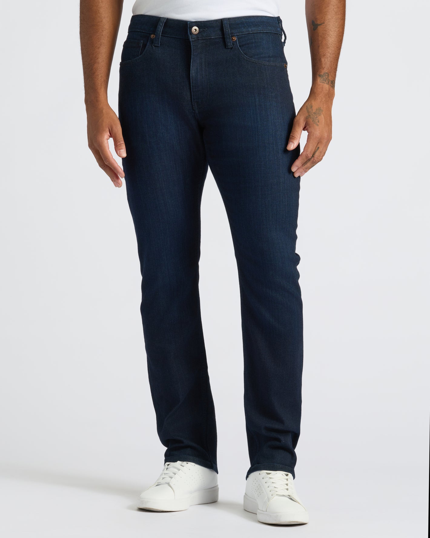 Medium Gray Wash Slim Comfort Stretch Jeans with white sneakers.