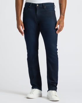 Medium Gray Wash Slim Comfort Stretch Jeans with white sneakers.