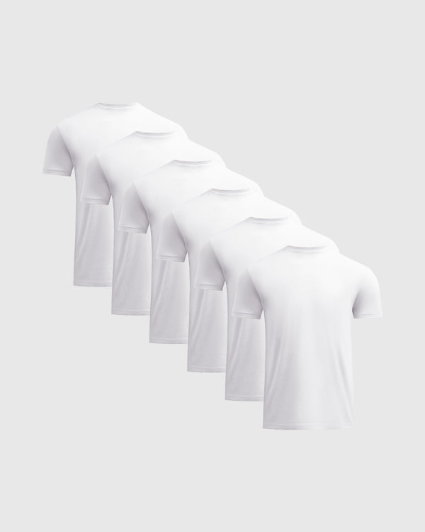 White Classic Crew Neck 6-Pack featuring six white short sleeve crew neck shirts for mens basics arranged in a staggered row on a light background
