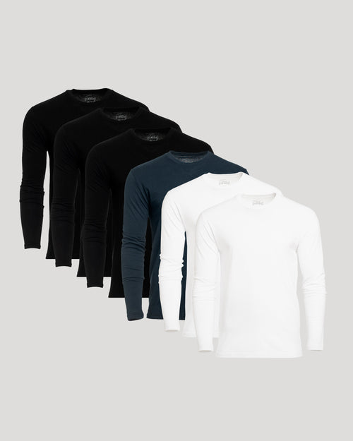 6 long-sleeve crew-neck shirts in black, dark navy, and white, arranged in a staggered fan layout on a light gray background.