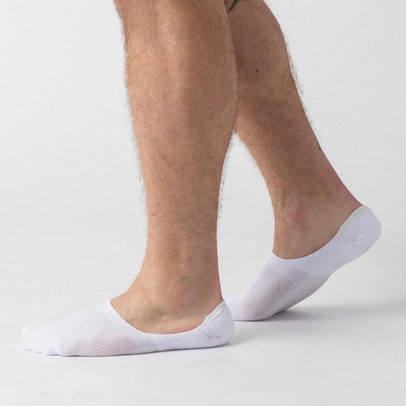 White Never Show Socks 3 Pack on feet against light background.