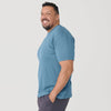 Man in Bluestone Short Sleeve Crew Neck Tee, smiling in profile.