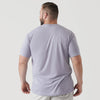 Man wearing Lilac Gray Short Sleeve Crew Neck Tee, facing away.