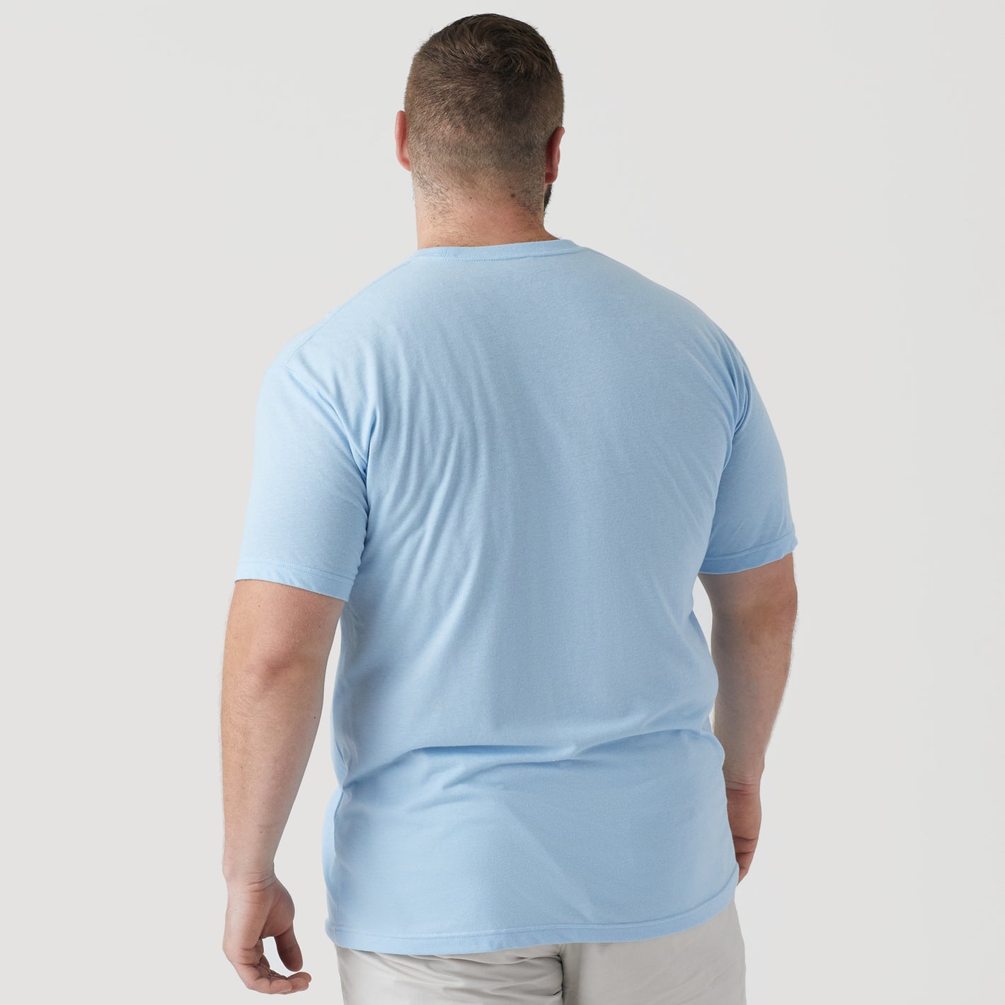 Man in Oxford Blue Short Sleeve Crew Neck Tee, back view.