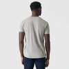 Man wearing Iron Gray Short Sleeve Crew Neck Tee and jeans, back view.