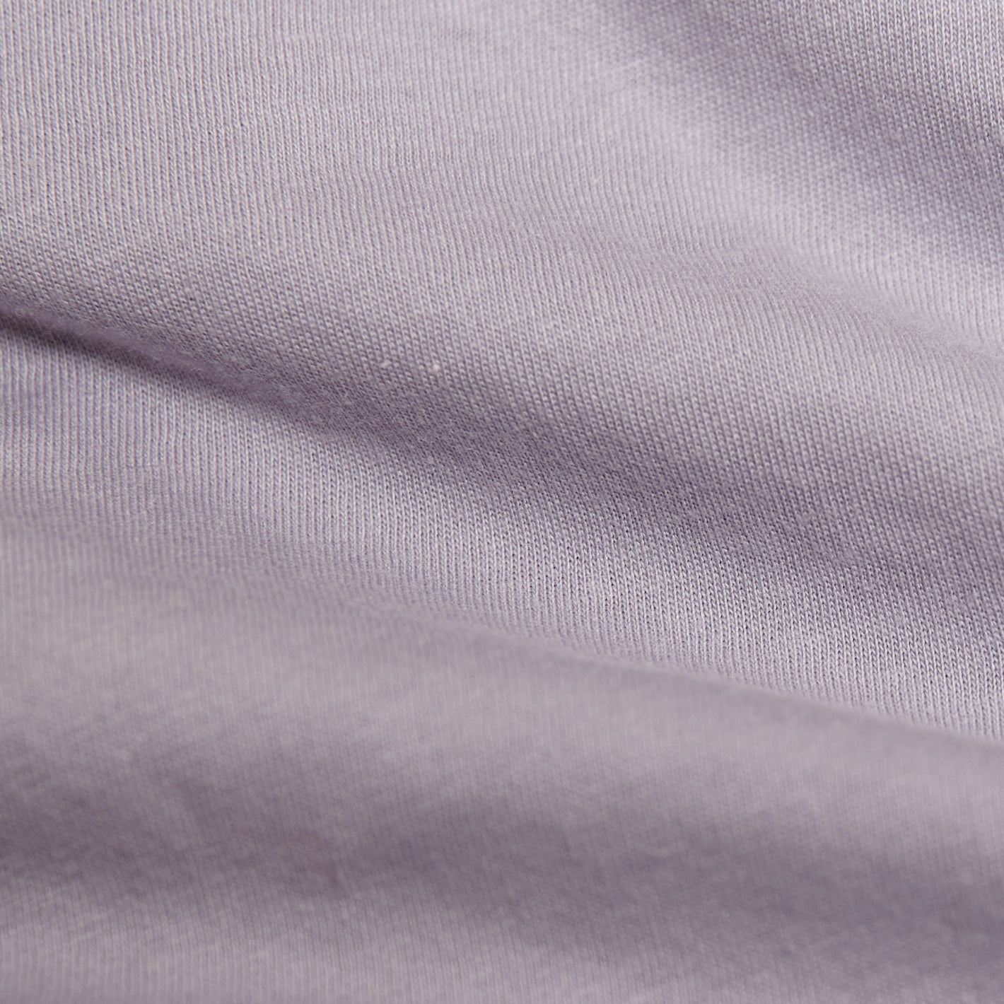 Lilac Gray Short Sleeve Crew Neck Tee with fine ribbing and soft folds.