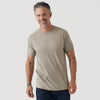 Man wearing Military Beige Short Sleeve Crew Neck Tee and dark jeans, smiling.