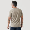 Man wearing Military Beige Short Sleeve Crew Neck Tee, showcasing tattoos and bracelets.