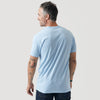 Man wearing Oxford Blue Short Sleeve Crew Neck Tee, showcasing tattoos.