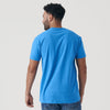 Man wearing Periwinkle Blue Short Sleeve Crew Neck Tee and jeans.