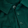 Emerald Classic Polo close-up with green buttons and collar.