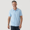 Man wearing Oxford Blue Short Sleeve Polo, smiling with tattooed forearms.