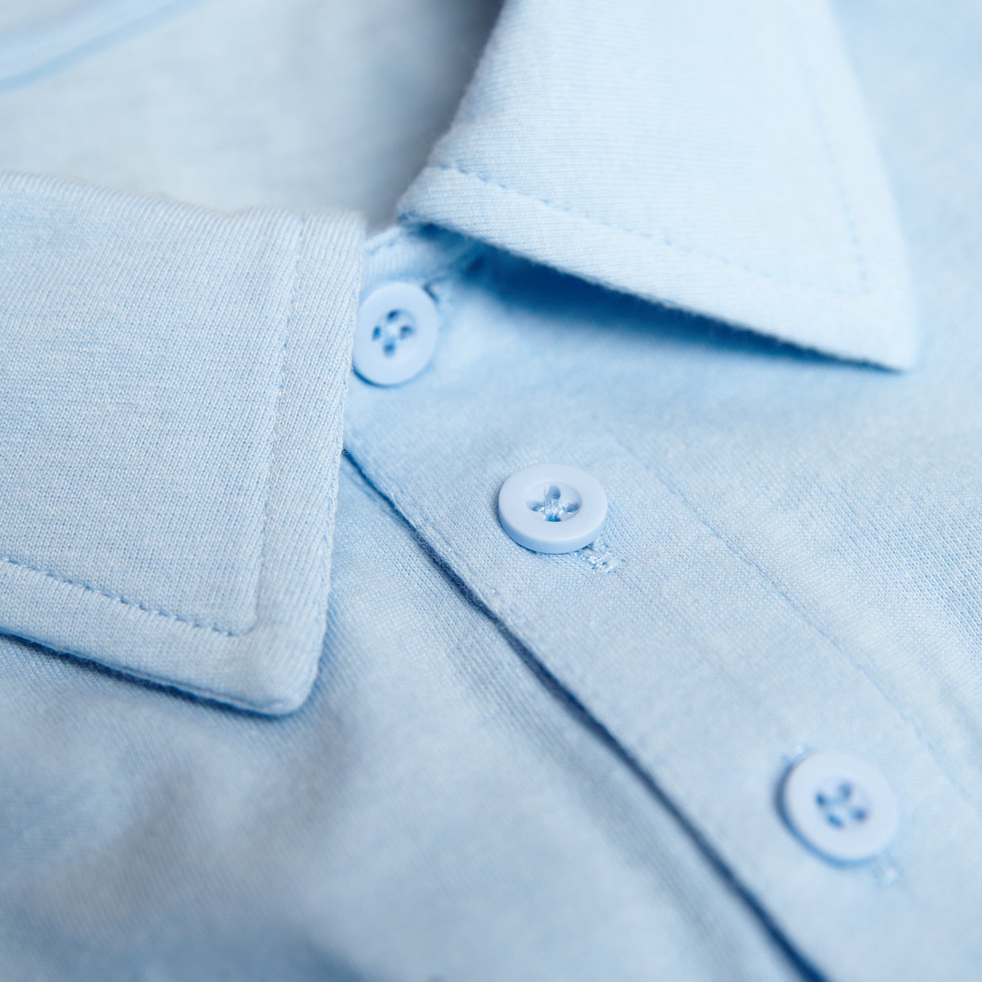 Oxford Blue Short Sleeve Polo collar and front placket with buttons.