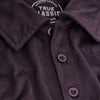 Dark Purple Short Sleeve Polo with folded collar and visible buttons.