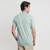 Man wearing Sage Short Sleeve Polo with light khaki pants.