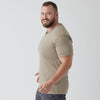 Man wearing Military Beige Classic V-Neck, smiling, in profile against plain background.