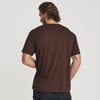 Man wearing Coffee V-Neck Tee, back view, plain background.