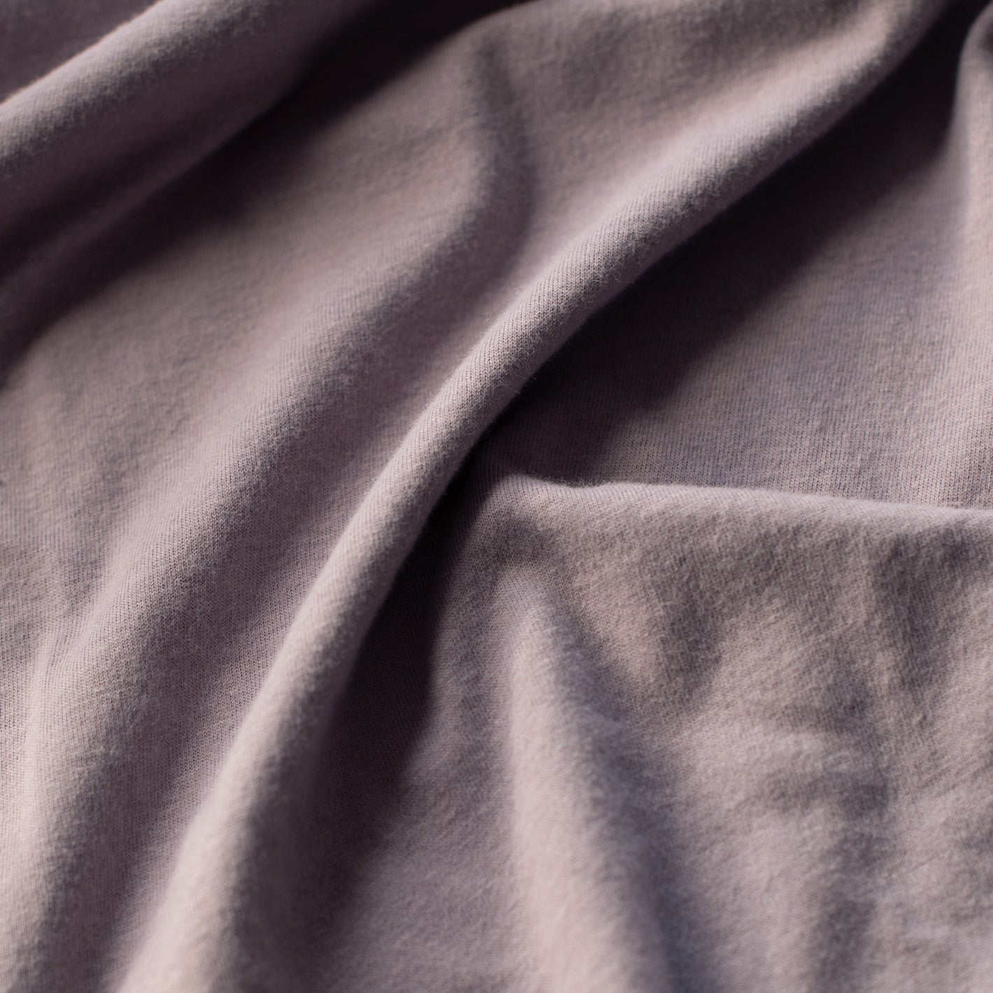Flint V-Neck Tee, softly draped knit fabric close-up.