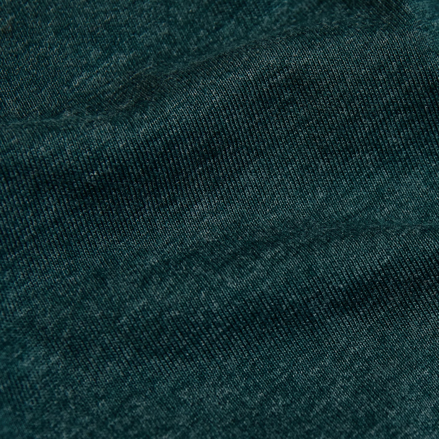 Heather Emerald V-Neck Tee fabric close-up, showing interlocking knit loops.
