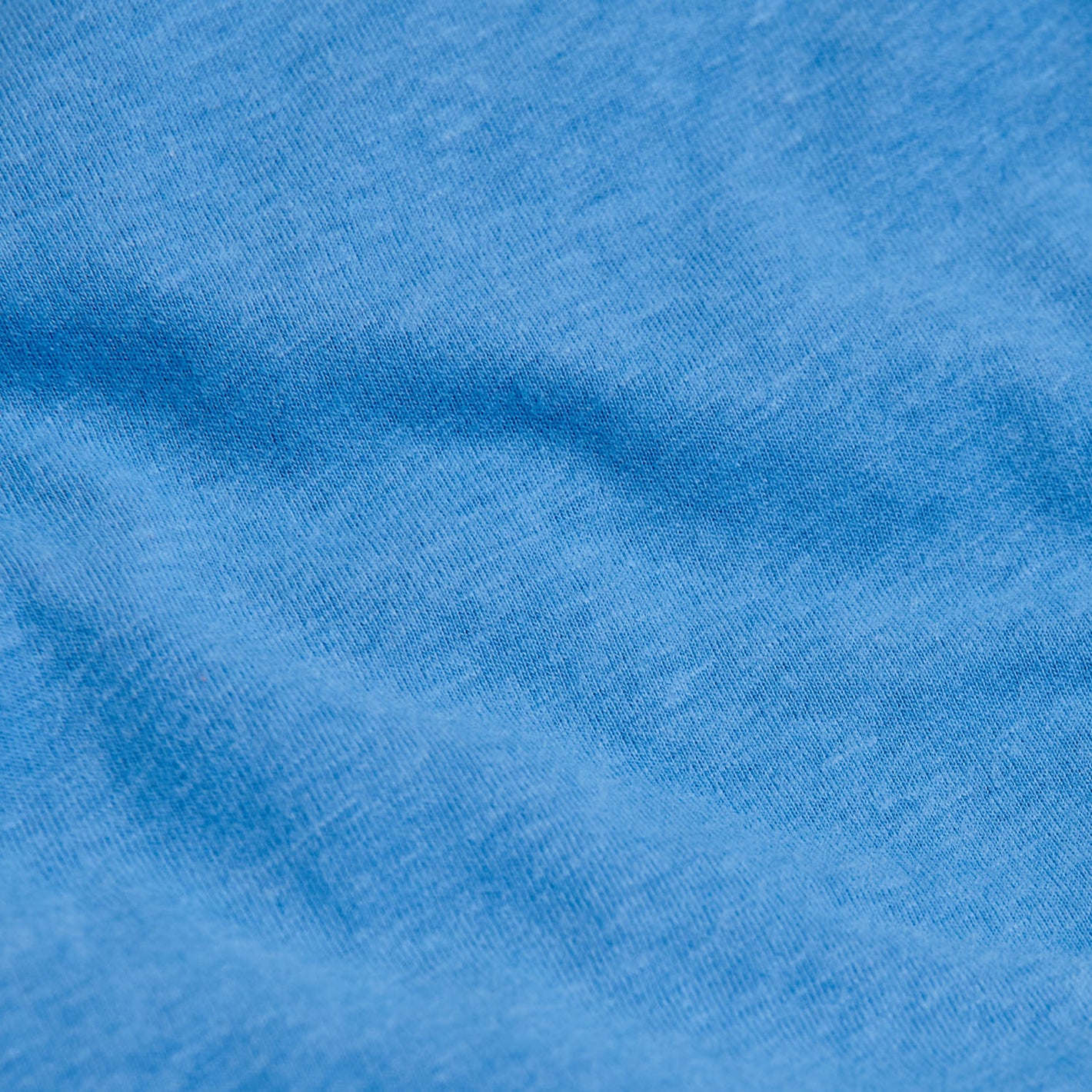 Periwinkle Blue V-Neck Tee in soft, heathered knit fabric.
