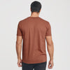 Man wearing Red Rock V-Neck Tee, back view, studio shot.