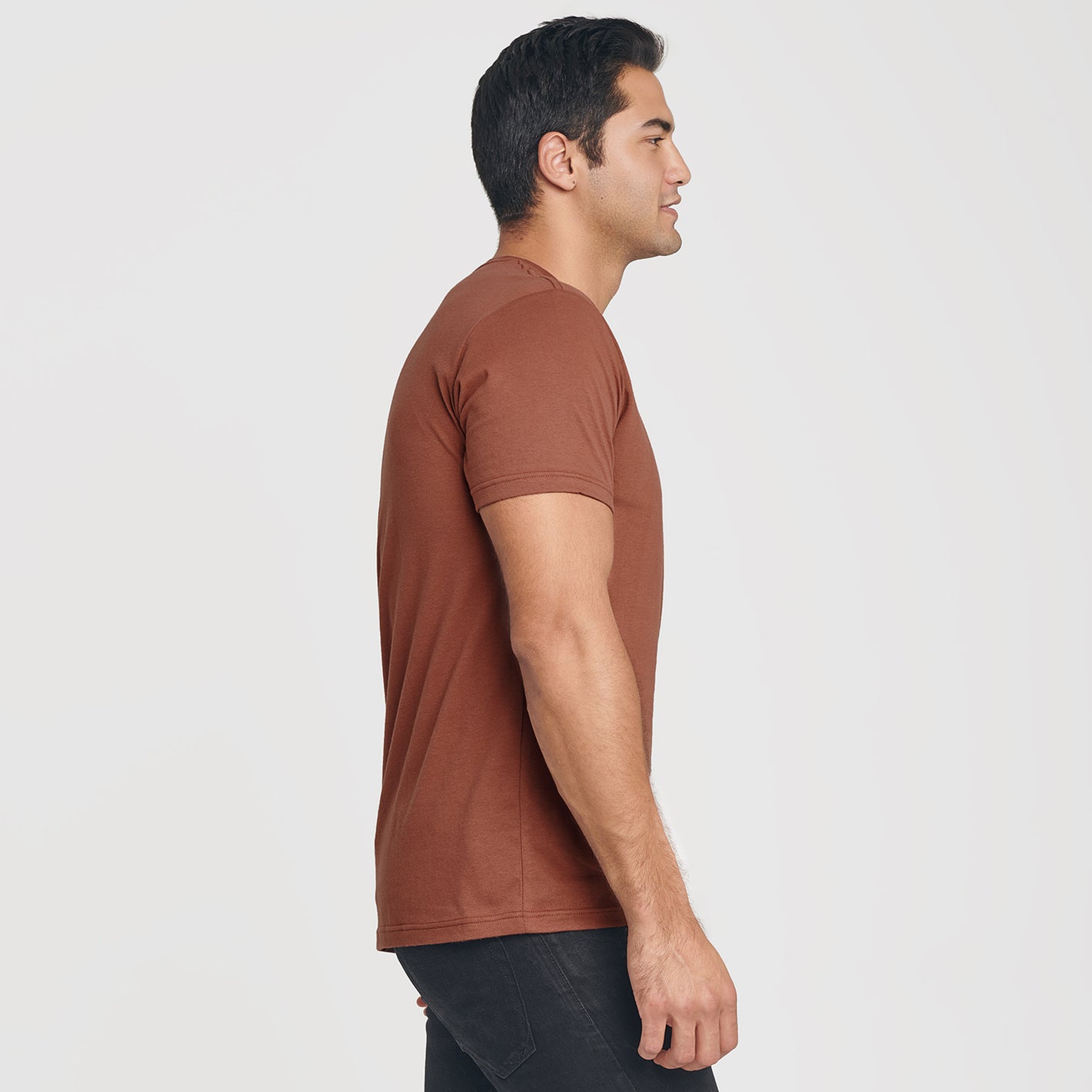 Man wearing Red Rock V-Neck Tee in profile view.