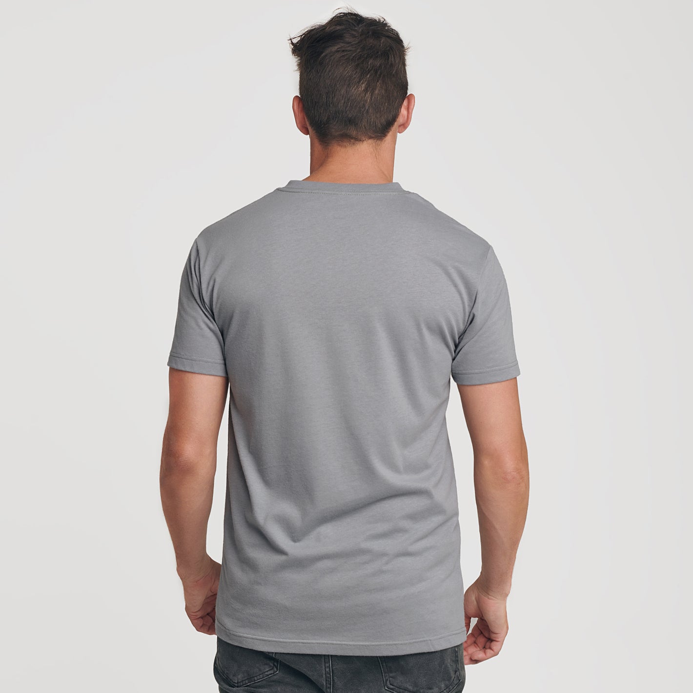 Man wearing Slate V-Neck Tee, back view, showcasing fit and design.