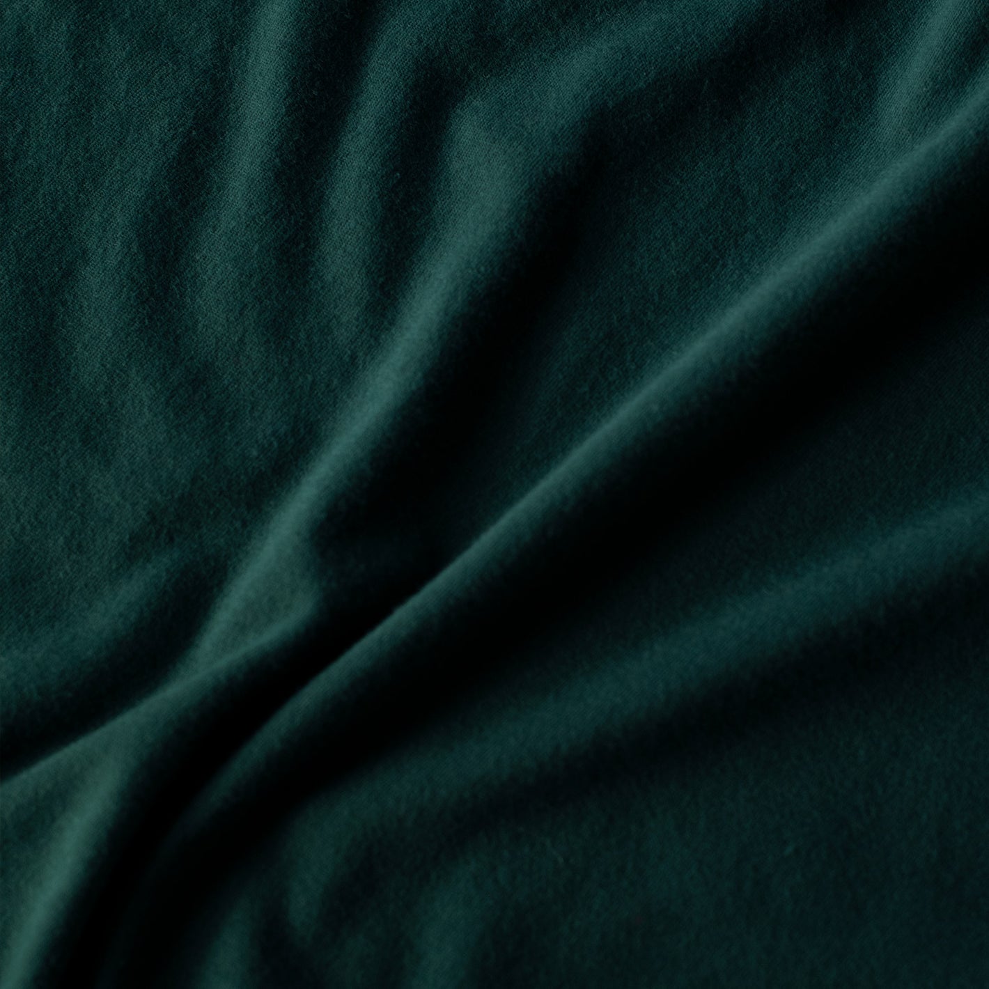 Forest Green Long Sleeve Crew Neck Tee, close-up of soft, textured fabric.